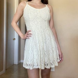 Cream American Eagle mini dress with lace detailing and razor back design